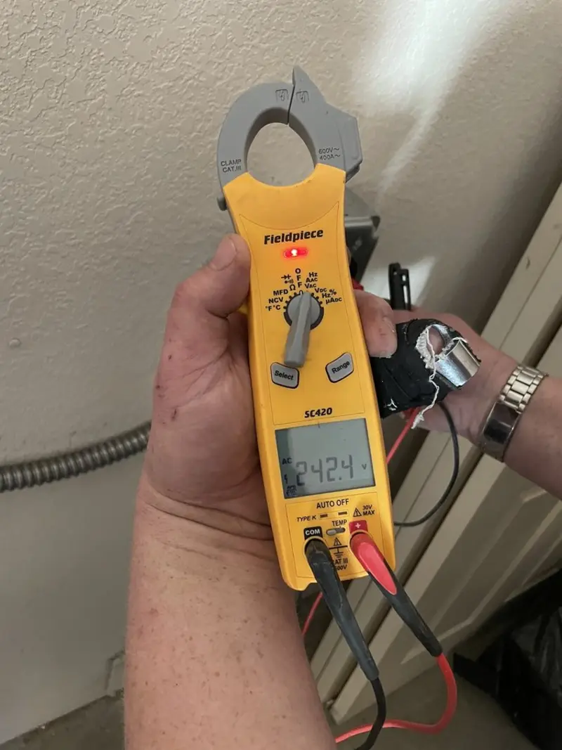 Voltage testing with clamp meter during Outlet Installation in York